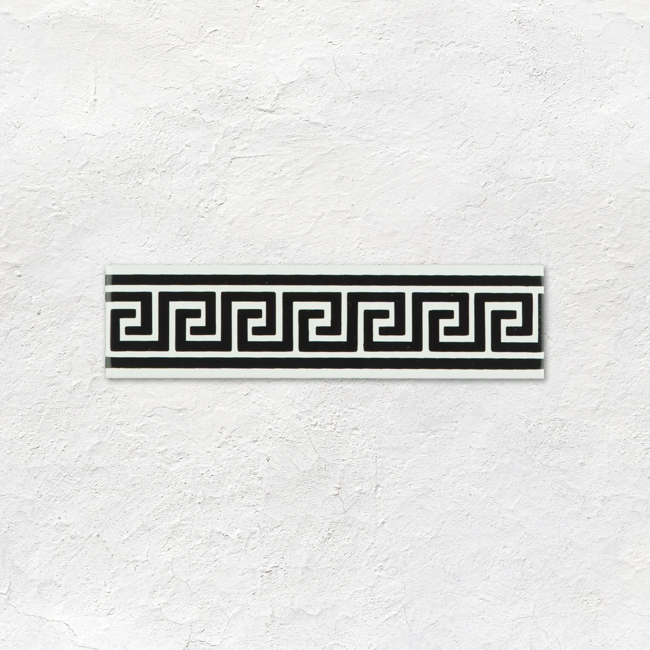 Jet Black Dentil Dado, Brilliant White Sigma and Jet Black Greek Key on Brilliant White (above) Jet Black Half Tile (middle) Brilliant White Skirting Tile (below)