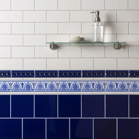 Brilliant White Half Tile (above) Royal Blue Dentil Dado, Brilliant White Omega Dado and Royal Blue Parthenon on Brilliant White (middle) Brilliant White Field Tile (below)