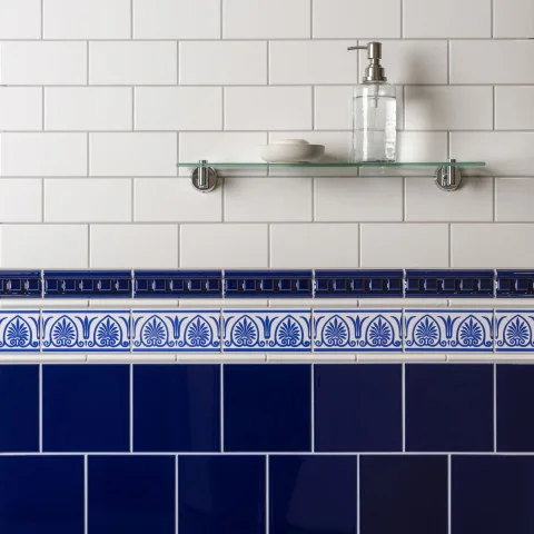 Brilliant White Half Tile (above) Royal Blue Dentil Dado, Brilliant White Omega Dado and Royal Blue Parthenon on Brilliant White (middle) Brilliant White Field Tile (below)