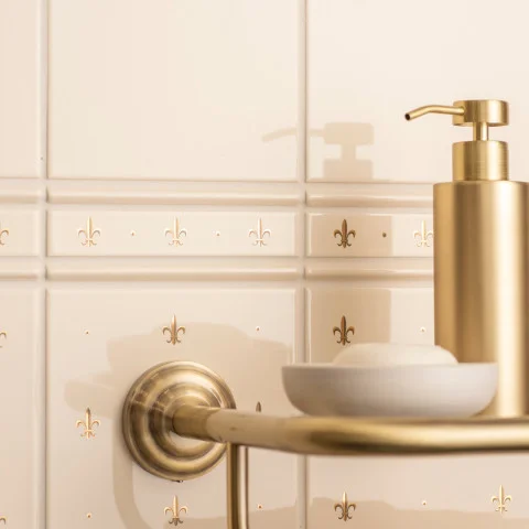 Colonial White Field Tile (above) Colonial White Omega Dado and Gold Fleur De Lis set/2 On Colonial White (middle) Gold Fleur De Lis On 6x1 Colonial White (below)